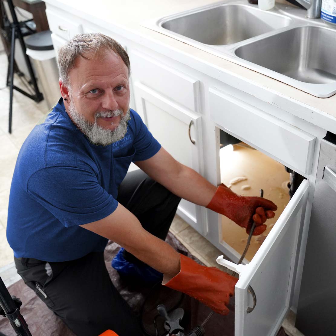 Plumber Inspecting a sink