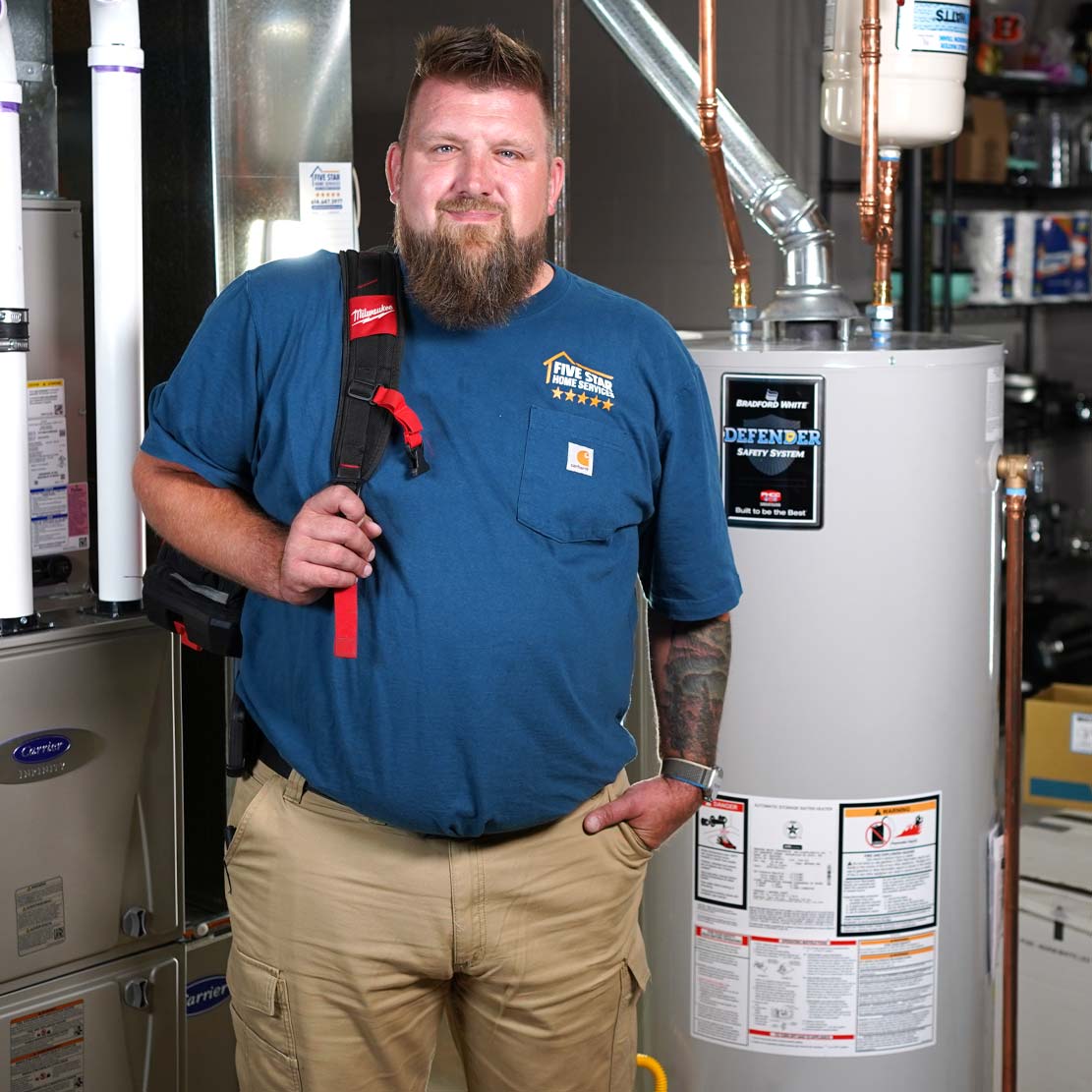 Plumber next to a Water Heater