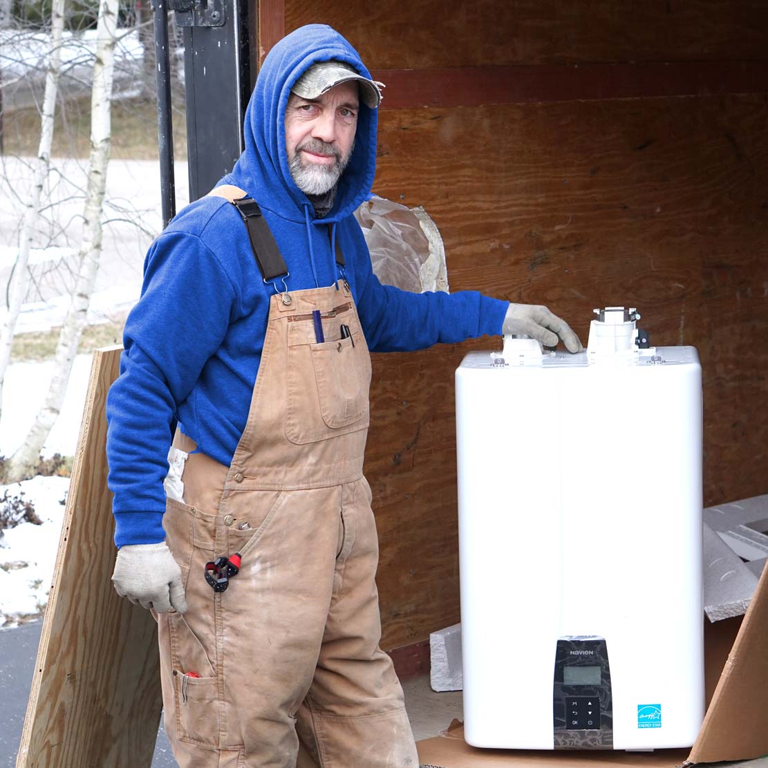 Plumber Next to a Tankless Water Heater