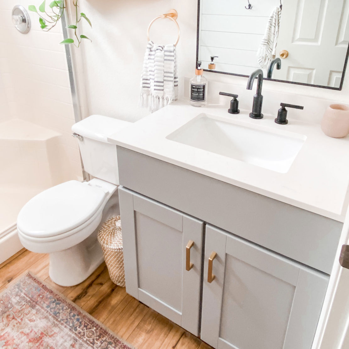 Bathroom toilet, sink and mirror