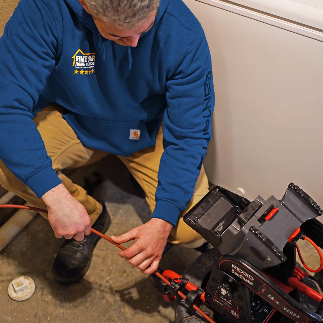 Plumber with a Video Camera Inspection